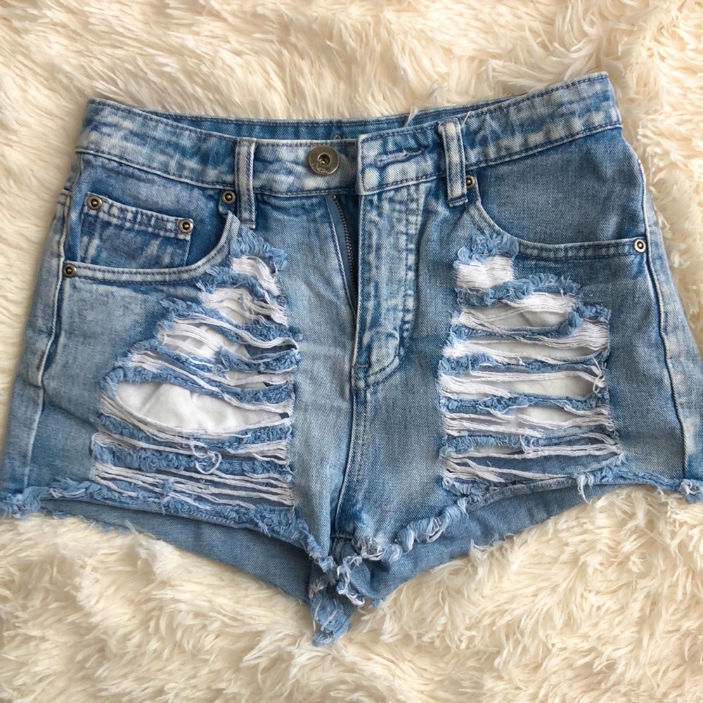 Ripped jean shorts front and back.